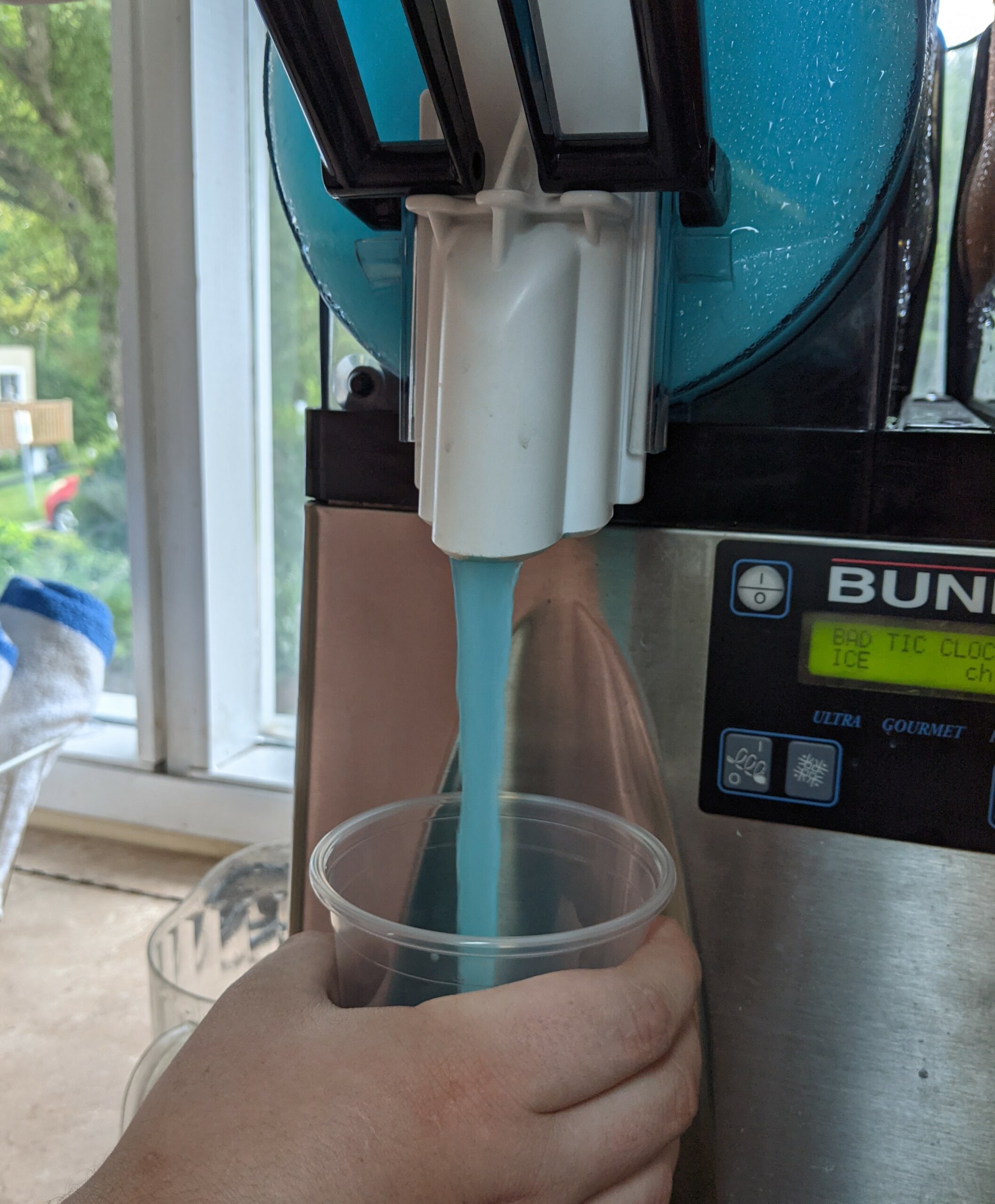 Blue Slushie being poured into a cup